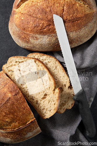 Image of homemade craft bread with kitchen knife