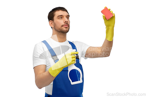 Image of male cleaner cleaning with sponge and detergent