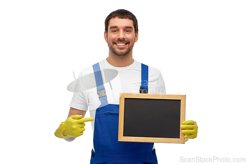 Image of smiling worker or male cleaner showing chalkboard