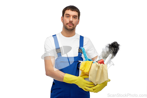 Image of male cleaner in overall with cleaning supplies