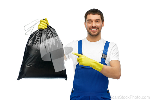 Image of happy male worker or cleaner showing garbage bag