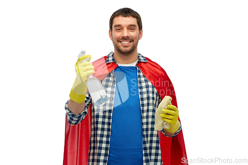 Image of smiling man in superhero cape with rag and cleaner