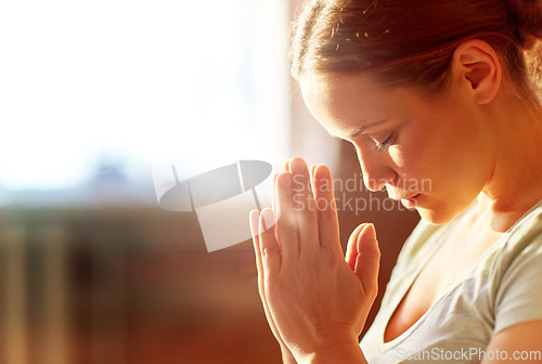 Image of close up of woman meditating at yoga studio