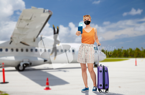 Image of woman in mask with bag and ticket over plain