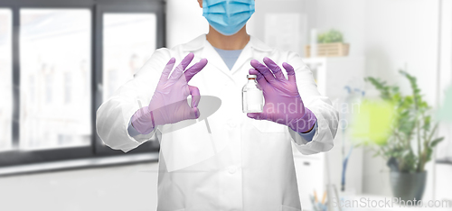 Image of close up of doctor with medicine showing ok sign