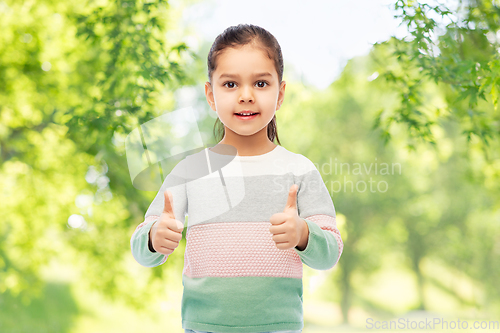 Image of happy smiling girl showing thumbs up