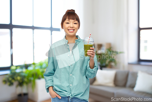 Image of happy smiling asian woman with can drink