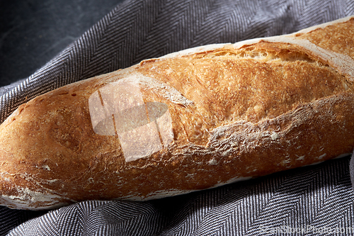 Image of close up of baguette bread on kitchen towel