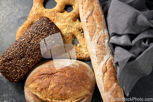 Image of close up of different bread on kitchen towel