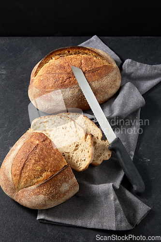 Image of homemade craft bread with kitchen knife