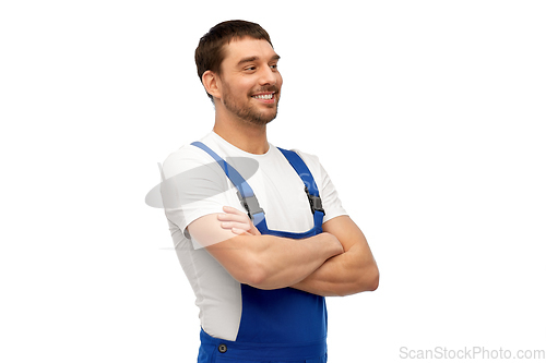 Image of happy smiling male worker or builder in overall