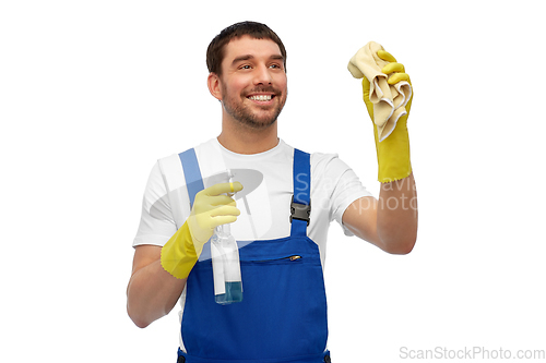 Image of male cleaner cleaning with rag and detergent