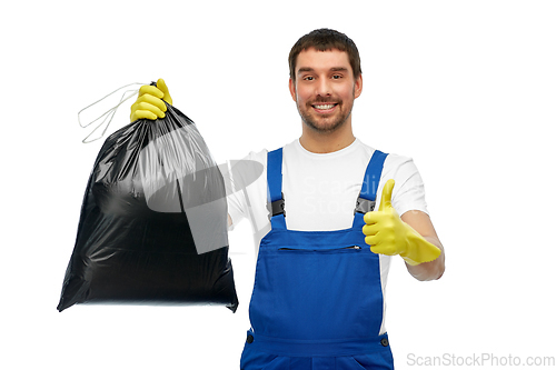 Image of male cleaner with garbage bag showing thumbs up