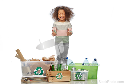 Image of happy girl sorting paper, metal and plastic waste