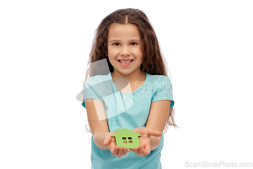 Image of smiling little girl holding green house icon