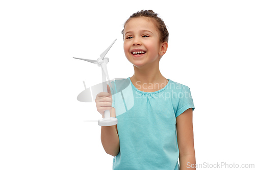 Image of smiling girl with toy wind turbine