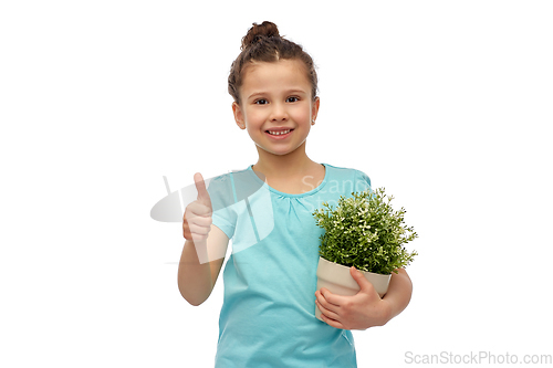 Image of smiling girl holding flower and showing thumbs up