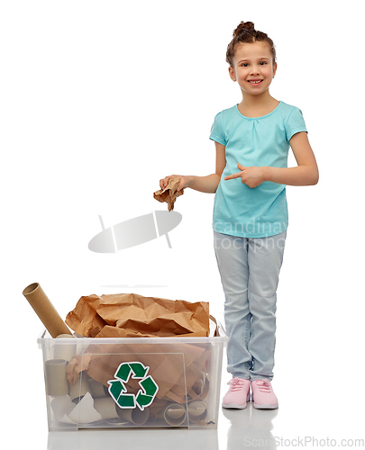 Image of smiling girl sorting paper waste