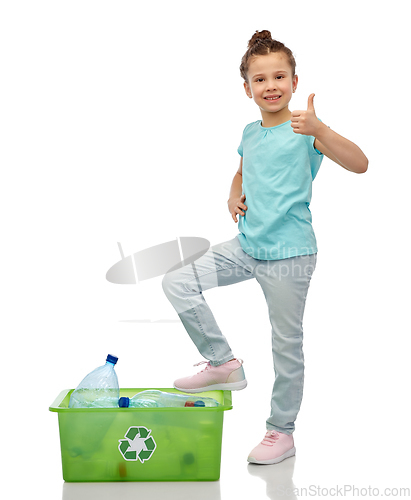 Image of girl sorting plastic waste and showing thumbs up