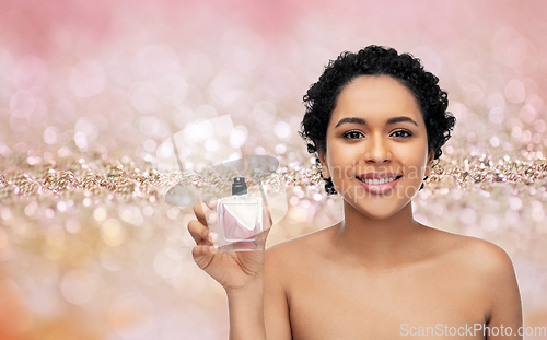 Image of young african american woman with perfume