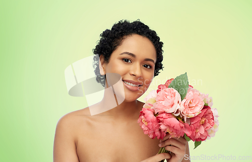 Image of portrait of african american woman with flowers