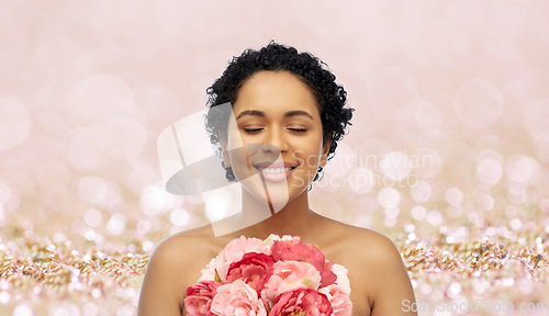 Image of portrait of african american woman with flowers