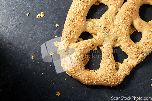 Image of close up of cheese bread on kitchen table