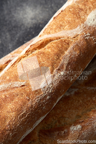 Image of close up of baguette bread on kitchen towel