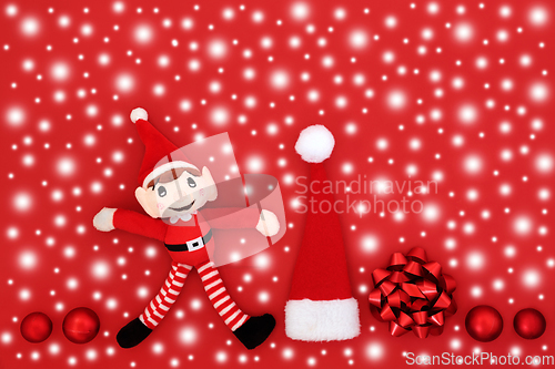 Image of Christmas Eve Snow Red Background with Santa Symbols  