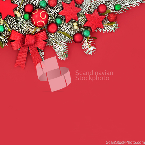 Image of Christmas Festive Red Background Border with Tree Decorations