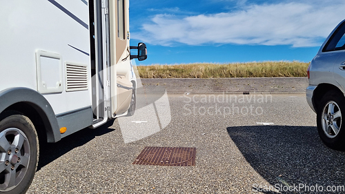 Image of Caravan car vacation. Family vacation travel RV. Holiday trip in motorhome. Zandvoort sand dunes, Netherlands