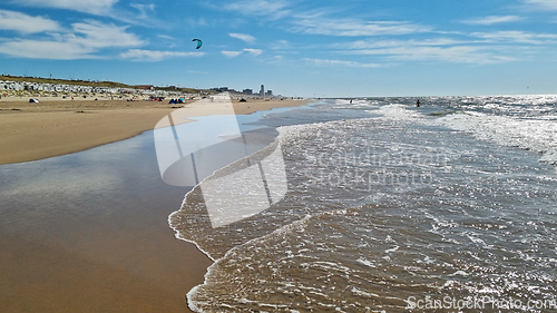 Image of View to the North Sea city beach on a sunny summer weekend. Typical pavilions. Zandvoort, Netherlands