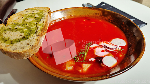 Image of Hot rich fresh borscht, beet soup with vegetables on a plate