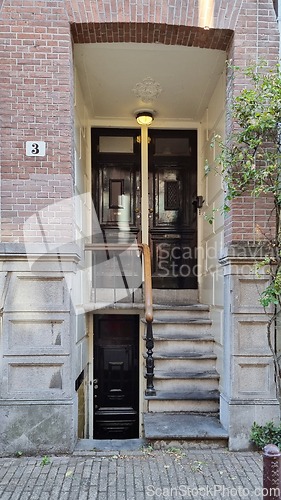 Image of Typical houses and doors in Amsterdam Netherlands. Old European city summer landscape