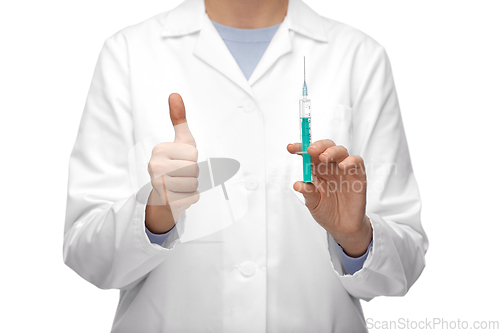 Image of close up of doctor with syringe showing thumbs up