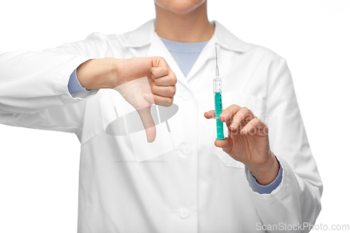 Image of close up of doctor with syringe shows thumbs down