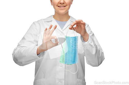 Image of smiling doctor with two masks showing ok sign