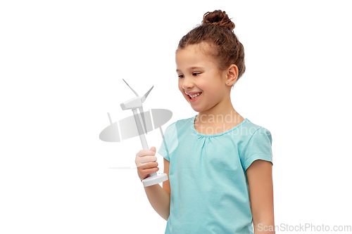 Image of smiling girl with toy wind turbine