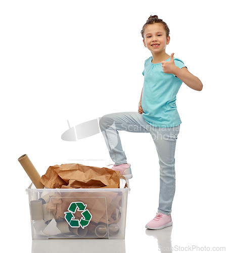 Image of girl sorting paper waste and showing thumbs up
