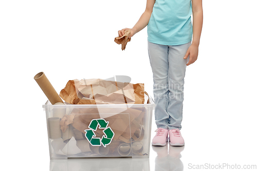 Image of smiling girl sorting paper waste