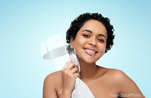 Image of young african american woman with bath towel