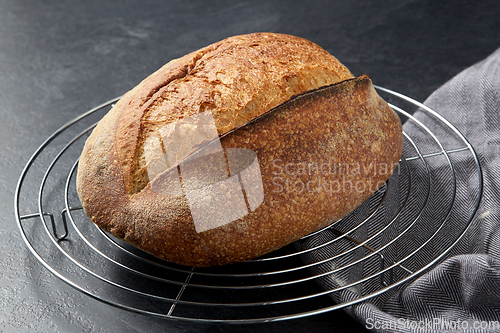 Image of homemade craft bread on stand on table