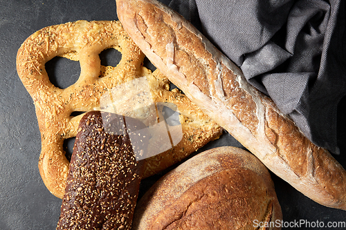 Image of close up of different bread on kitchen towel