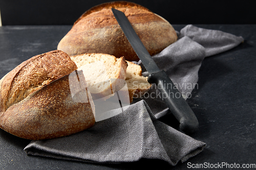 Image of homemade craft bread with kitchen knife