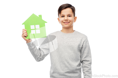 Image of smiling boy holding green house icon