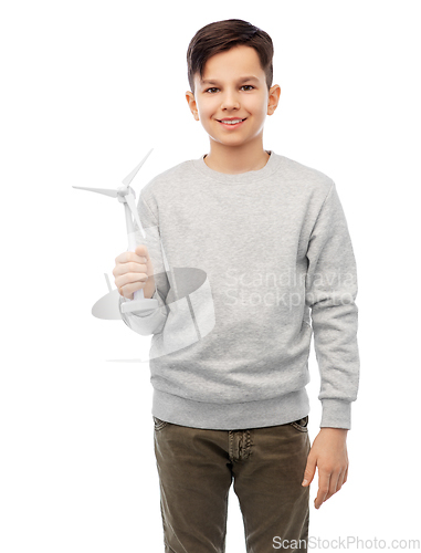 Image of smiling boy with toy wind turbine