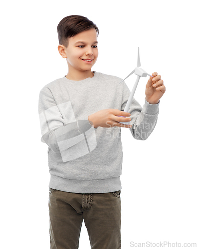 Image of smiling boy with toy wind turbine