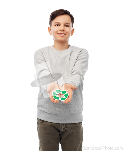 Image of smiling boy holding green recycling sign