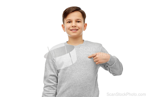 Image of happy smiling boy pointing fingers at himself