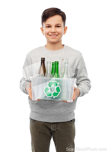 Image of smiling boy sorting glass waste